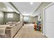 Spacious basement with a large sectional sofa, perfect for relaxation and entertainment at 11367 Zanardi Ct, Zionsville, IN 46077