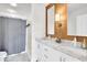 Bright bathroom with double vanity, marble countertops, modern fixtures, and a stylish shower curtain at 11367 Zanardi Ct, Zionsville, IN 46077