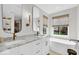 Bright and airy bathroom with a soaking tub, double vanity, and modern fixtures for a relaxing retreat at 11367 Zanardi Ct, Zionsville, IN 46077