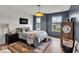 Comfortable bedroom with neutral tones, soft lighting, and rustic decor, perfect for relaxation at 11367 Zanardi Ct, Zionsville, IN 46077