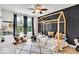Stylish bedroom with a cozy bed frame, ample natural light, and a playful design at 11367 Zanardi Ct, Zionsville, IN 46077