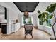 Elegant dining area with wainscoting, modern lighting, and hardwood flooring at 11367 Zanardi Ct, Zionsville, IN 46077