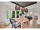 Chic dining room with modern lighting and ample natural light at 11367 Zanardi Ct, Zionsville, IN 46077