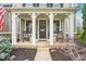 Inviting front porch featuring rocking chairs and charming decor at 11367 Zanardi Ct, Zionsville, IN 46077