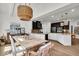 Open-concept kitchen with a large island, farmhouse style table and vaulted ceiling at 11367 Zanardi Ct, Zionsville, IN 46077
