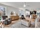 Bright, open-concept living room connects to the kitchen and dining area with seamless flow at 11367 Zanardi Ct, Zionsville, IN 46077
