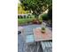 Backyard patio featuring tiled furniture with cushioned seating, set on a paved patio at 11691 Diamond Pointe Ct, Indianapolis, IN 46236