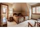 Bedroom showcasing two beds, a side table, and a view to the outside at 11691 Diamond Pointe Ct, Indianapolis, IN 46236