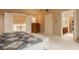 Bedroom with neutral colors, access to the bathroom and a view from the window at 11691 Diamond Pointe Ct, Indianapolis, IN 46236