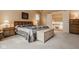Spacious bedroom with neutral carpet, large bed, and plenty of natural light and storage at 11691 Diamond Pointe Ct, Indianapolis, IN 46236