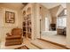 Upstairs bedroom nook with chair, book shelves and stained-glass window for natural light at 11691 Diamond Pointe Ct, Indianapolis, IN 46236