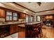 Traditional kitchen features a breakfast bar and hardwood floors throughout the space at 11691 Diamond Pointe Ct, Indianapolis, IN 46236