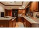 Kitchen with custom wood cabinets, hardwood floors, lots of counter space and stainless appliances at 11691 Diamond Pointe Ct, Indianapolis, IN 46236