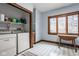 Functional laundry room with modern appliances, storage shelves and table at 11691 Diamond Pointe Ct, Indianapolis, IN 46236