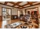 Inviting living room with classic furniture, hardwood floors and coffered ceilings at 11691 Diamond Pointe Ct, Indianapolis, IN 46236
