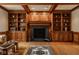 Elegant living room boasts custom built-ins and a cozy fireplace at 11691 Diamond Pointe Ct, Indianapolis, IN 46236