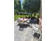 Outdoor patio area featuring tile stones and a seating area with views of the backyard at 11691 Diamond Pointe Ct, Indianapolis, IN 46236
