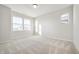 Empty bedroom featuring carpeted floors, white walls, and lots of natural light from multiple windows at 12015 Jeff Ct, Noblesville, IN 46060