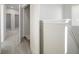 Hallway looking into a bathroom and bedrooms that is carpeted with white doors and white trim at 12015 Jeff Ct, Noblesville, IN 46060
