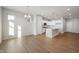 Open-concept kitchen with an island, white cabinets, modern appliances, and lots of light at 12015 Jeff Ct, Noblesville, IN 46060