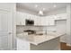 Well-equipped kitchen features a large island, granite countertops, and stainless-steel appliances at 12015 Jeff Ct, Noblesville, IN 46060