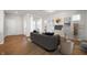 Staged living room features hardwood flooring, light colored walls, and neutral furniture at 12015 Jeff Ct, Noblesville, IN 46060