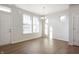 Well-lit living room with hardwood floors, and windows showcasing natural light at 12015 Jeff Ct, Noblesville, IN 46060