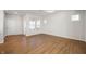 Bright, empty living room features hardwood floors and plenty of natural light at 12015 Jeff Ct, Noblesville, IN 46060