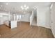Open-concept living space features a modern kitchen and sun-drenched living room at 12015 Jeff Ct, Noblesville, IN 46060