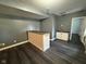 Spacious basement features custom bar area with modern countertops and new sink at 1258 Soaring Eagle Dr, Greenwood, IN 46143