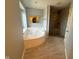 Bright bathroom features a jacuzzi tub, glass enclosed shower and lots of natural light at 1258 Soaring Eagle Dr, Greenwood, IN 46143