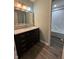 Elegant bathroom featuring a modern vanity, marble countertop, and a tiled shower at 1258 Soaring Eagle Dr, Greenwood, IN 46143