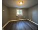 Cozy bedroom with new flooring and a window bringing in natural light at 1258 Soaring Eagle Dr, Greenwood, IN 46143