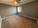 Cozy bedroom with plush carpeting, neutral walls, ceiling fan, and plenty of natural light at 1258 Soaring Eagle Dr, Greenwood, IN 46143