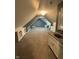 Finished bonus room features carpet, shelving, and a versatile layout with a sink at 1258 Soaring Eagle Dr, Greenwood, IN 46143
