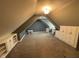 Finished bonus room features built-in shelving, plush carpet, and a versatile layout at 1258 Soaring Eagle Dr, Greenwood, IN 46143
