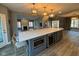 Large open concept kitchen with large island and stainless steel microwave at 1258 Soaring Eagle Dr, Greenwood, IN 46143