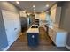 Beautiful open kitchen with stainless steel appliances, white cabinetry, and an island at 1258 Soaring Eagle Dr, Greenwood, IN 46143