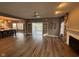 Bright living room featuring a fireplace, hardwood floors, and a view of the patio at 1258 Soaring Eagle Dr, Greenwood, IN 46143