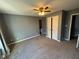 Spacious main bedroom with plush carpeting, neutral walls, and a double door closet at 1258 Soaring Eagle Dr, Greenwood, IN 46143