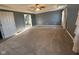 Spacious main bedroom with plush carpeting, ceiling fan, and an ensuite bathroom at 1258 Soaring Eagle Dr, Greenwood, IN 46143