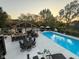 A stunning backyard featuring a large in-ground pool, outdoor kitchen, and ample seating at 1258 Soaring Eagle Dr, Greenwood, IN 46143