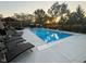 A beautiful pool with lounge chairs, and an outdoor kitchen at 1258 Soaring Eagle Dr, Greenwood, IN 46143