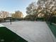 A spacious concrete volleyball/basketball court perfect for outdoor entertainment and recreation at 1258 Soaring Eagle Dr, Greenwood, IN 46143