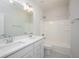 Modern bathroom featuring double vanity, quartz counters, and shower-tub combo at 15810 Vitalize Run, Fishers, IN 46040