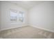 A bright bedroom with two windows and neutral carpet at 15810 Vitalize Run, Fishers, IN 46040