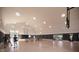 Community gymnasium featuring a basketball court, volleyball net, and large windows at 15810 Vitalize Run, Fishers, IN 46040