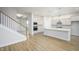 Open kitchen features stainless steel appliances and a large island with breakfast bar at 15810 Vitalize Run, Fishers, IN 46040
