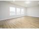Bright living room features hardwood floors, recessed lighting and large windows at 15810 Vitalize Run, Fishers, IN 46040