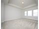 Spacious main bedroom with recessed lighting, three windows and neutral carpeting at 15810 Vitalize Run, Fishers, IN 46040